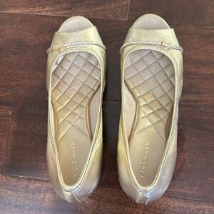 Open toe Cole Haan shoes.